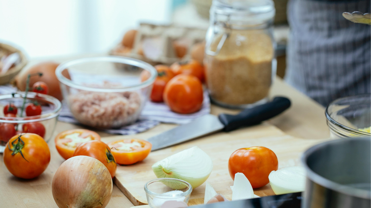 Preparing rotisserie chicken and fresh salads in the Five Rivers kitchen
