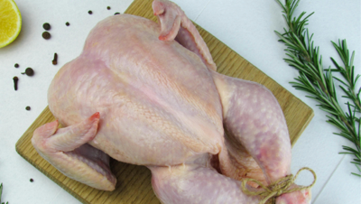 Halal-certified chicken preparation with focus on ethical handling and clean kitchen environment