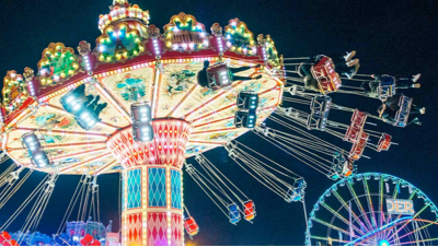 Visitors walking through the Winter Wonderland entrance at night